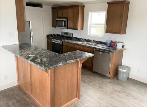 Kitchen Breakfast Bar with Stainless Appliances