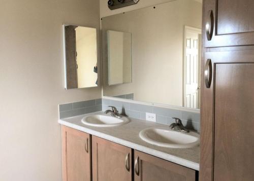 Master Bathroom with Double Sink and Vanity with Walk-In Tile & Shower