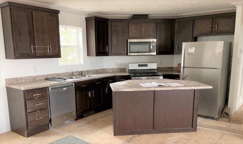 Kitchen Island with Stainless Appliances